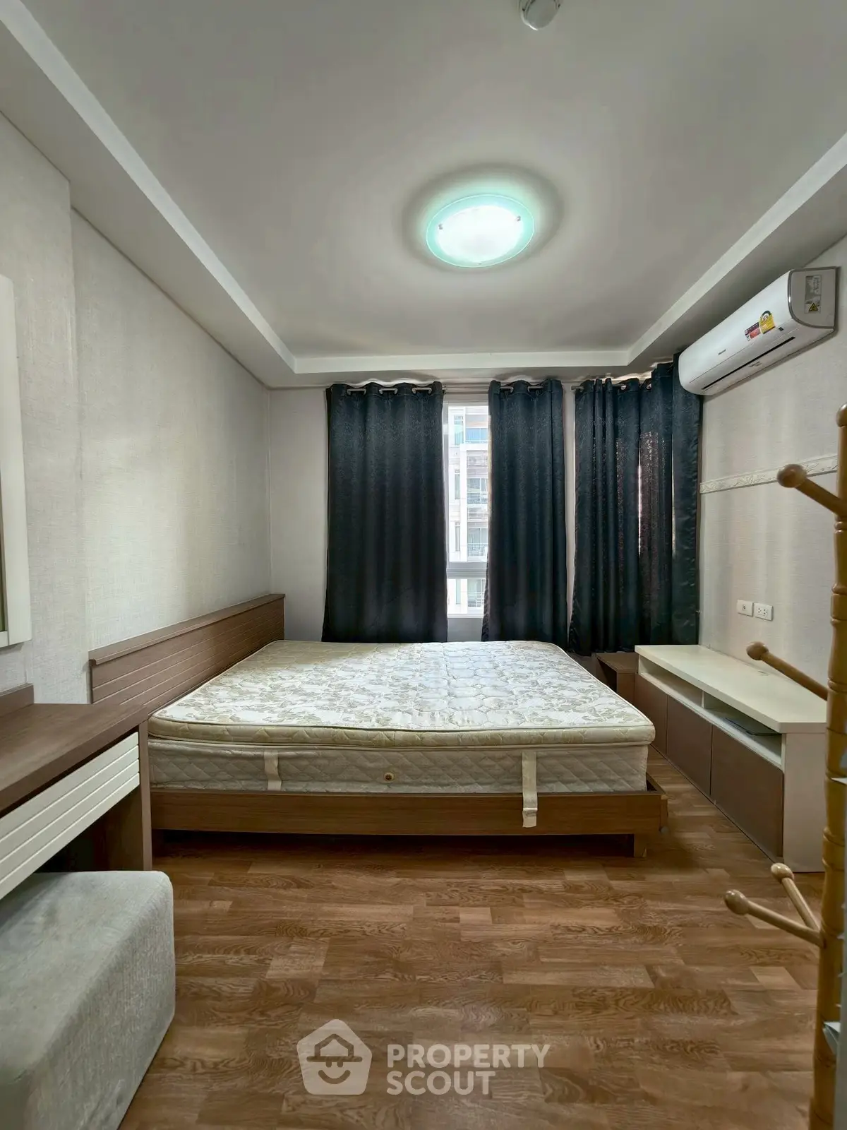 Cozy bedroom with modern furnishings and natural light