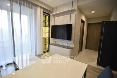 Modern living room with sleek TV setup and elegant marble accents