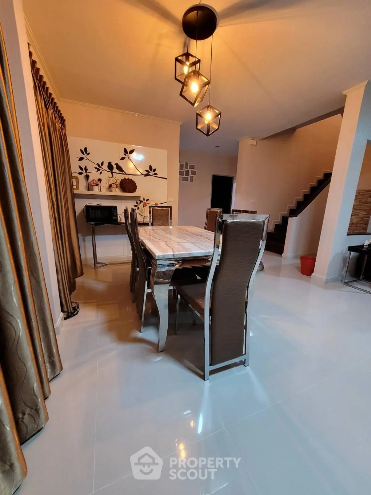 Elegant dining room with modern lighting and stylish decor