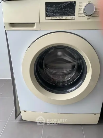 Modern washing machine in sleek laundry room setting