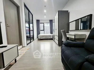 Modern studio apartment with sleek design and ample natural light