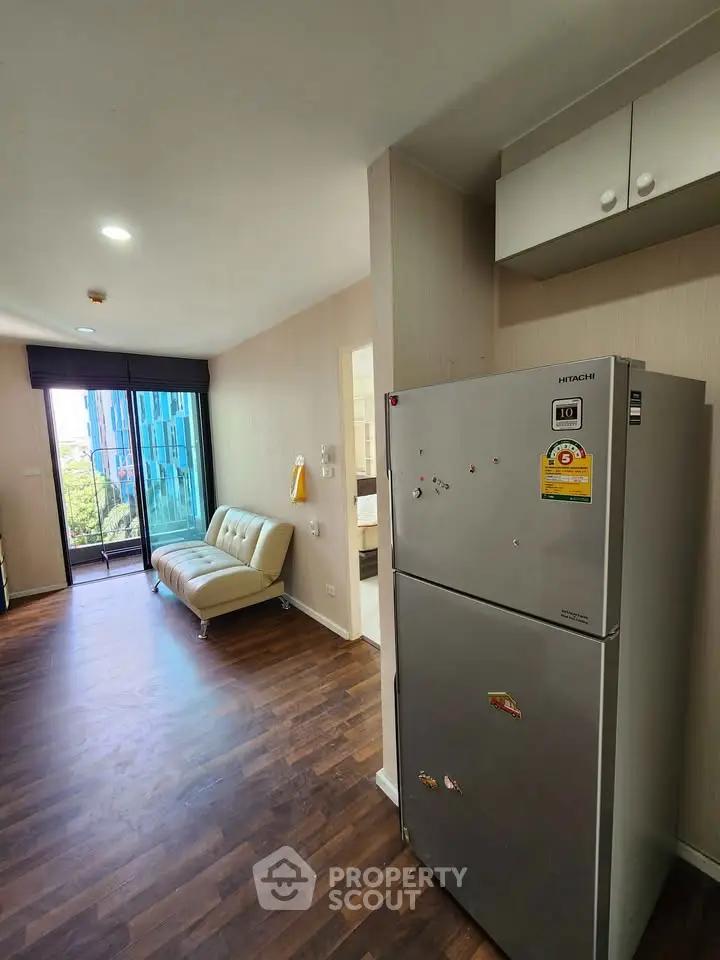 Modern apartment interior with wooden flooring and large window view
