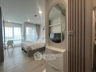 Modern bedroom with large windows and stylish decor in a high-rise apartment
