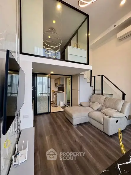 Modern duplex living room with high ceiling and stylish mezzanine