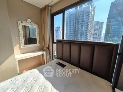 Modern bedroom with city view and elegant decor in high-rise apartment