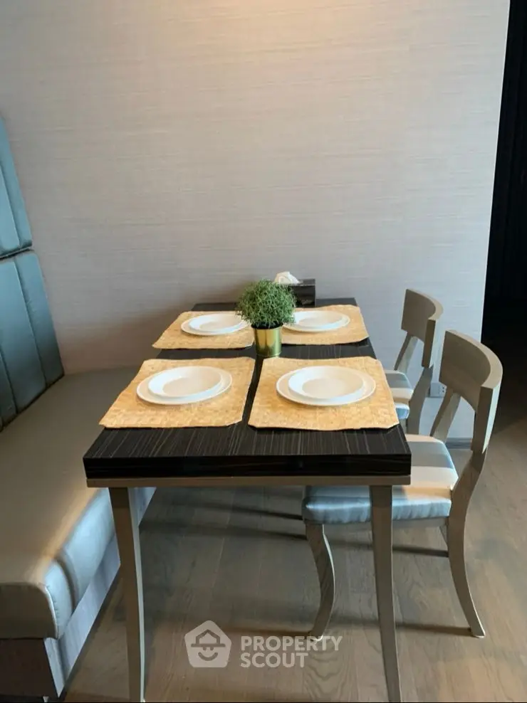 Modern dining area with elegant table setting and stylish chairs