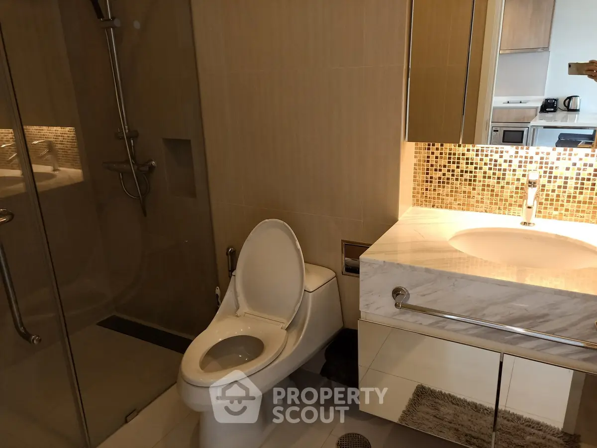 Modern bathroom with sleek fixtures and stylish tile accents