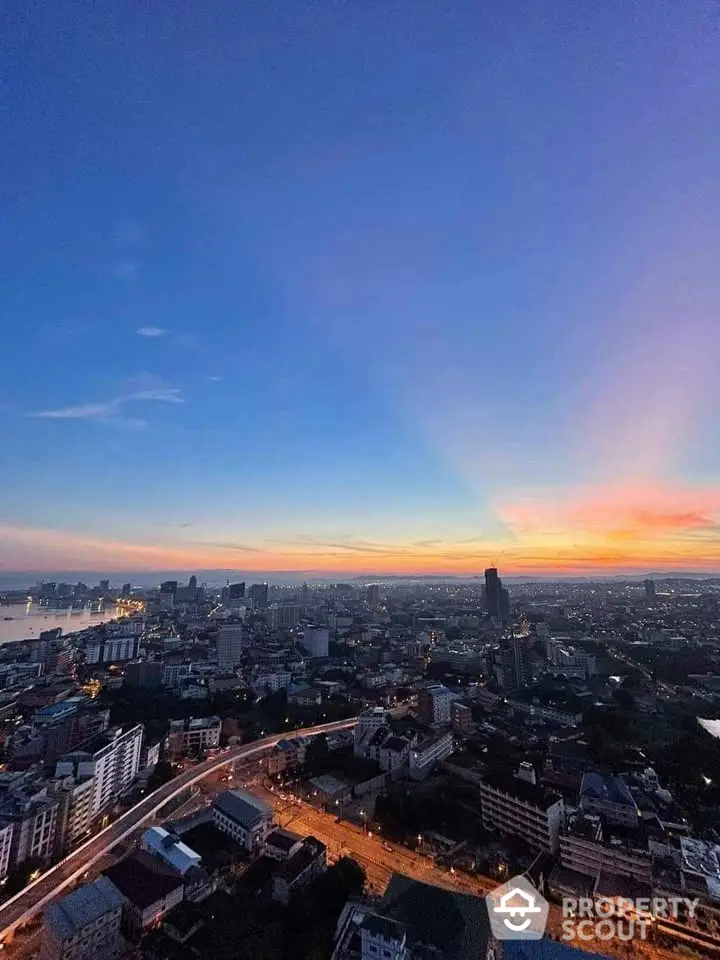 Stunning cityscape view at sunset showcasing vibrant skyline and urban landscape.