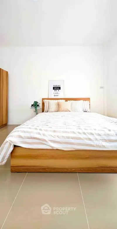 Modern bedroom with wooden bed frame and minimalist decor