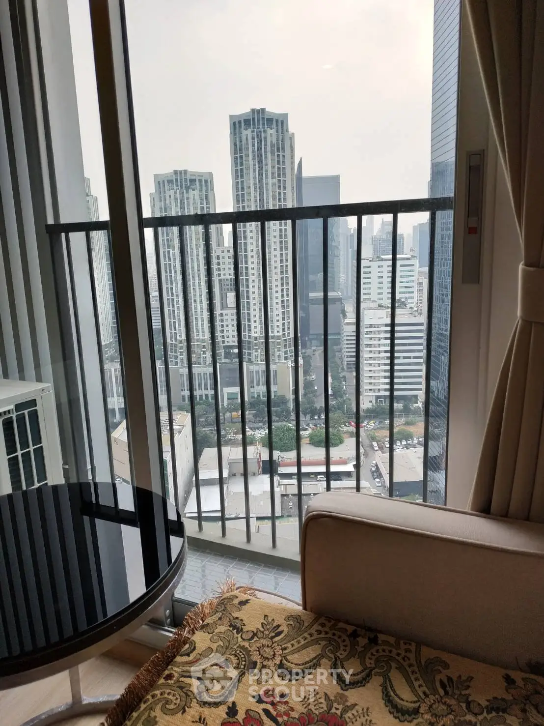 High-rise apartment balcony with stunning cityscape view
