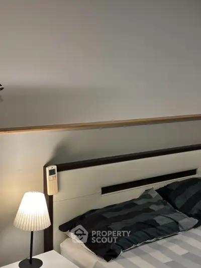 Modern bedroom with stylish headboard and cozy lighting