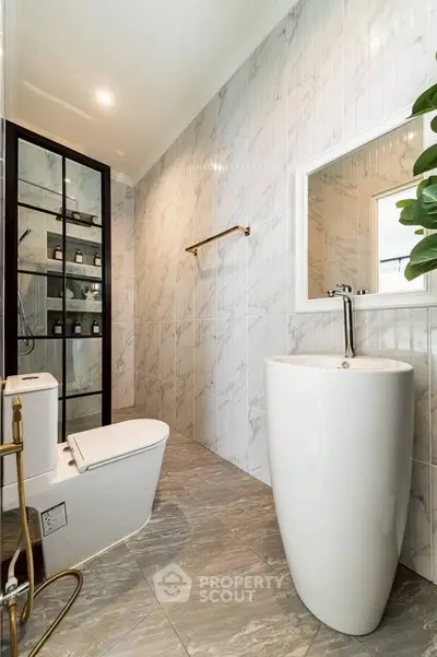 Luxurious modern bathroom with elegant fixtures and marble tiles
