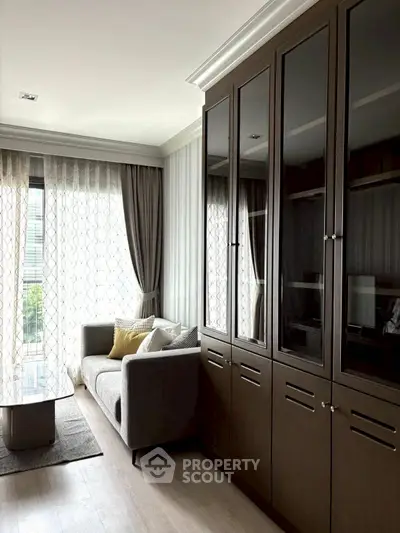 Stylish living room with elegant cabinetry and cozy sofa in modern apartment