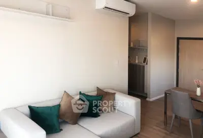 Modern living room with stylish sofa and air conditioning, perfect for cozy relaxation.