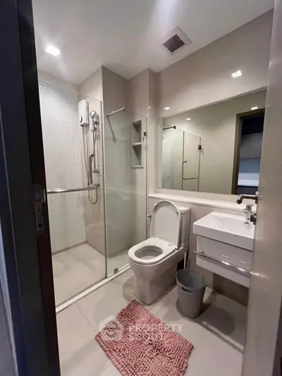 Modern bathroom with glass shower and sleek fixtures