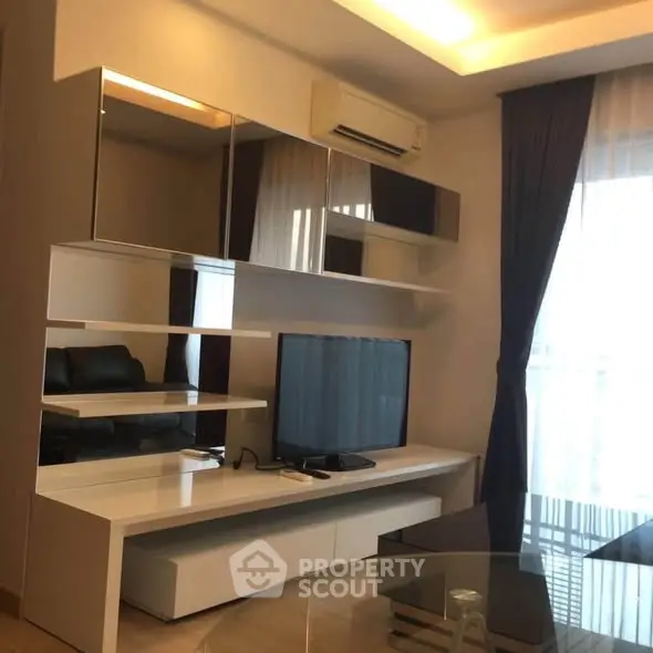 Modern living room with sleek TV unit and stylish decor
