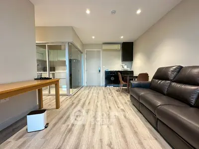 Modern living room with sleek flooring and stylish furniture