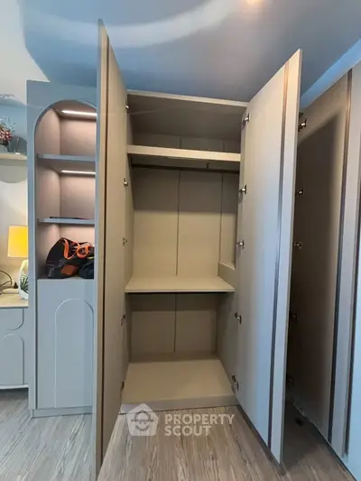 Spacious modern storage cabinet with sleek design and ample shelving in a stylish interior setting.