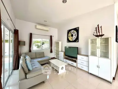 Spacious modern living room with sleek furniture and natural light