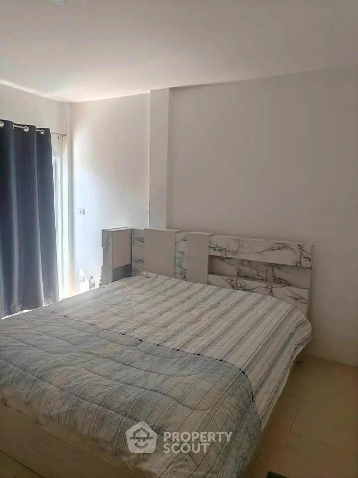 Cozy bedroom with modern decor and natural light