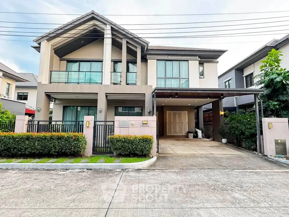 Stunning modern two-story house with spacious driveway and lush greenery in a serene neighborhood.