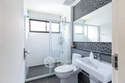 Modern bathroom with sleek shower and stylish sink area