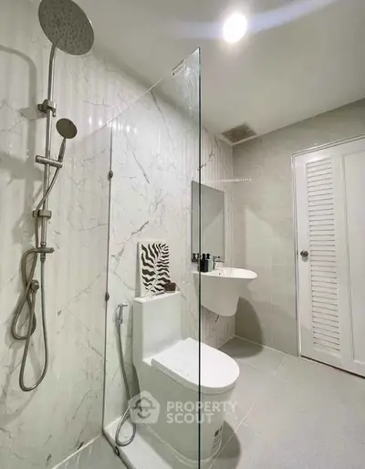 Modern bathroom with sleek shower and elegant marble walls