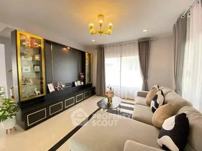 Elegant living room with modern decor, plush sofa, and stylish lighting, perfect for relaxation and entertainment.