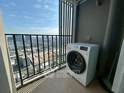 High-rise balcony with washing machine and stunning city view.