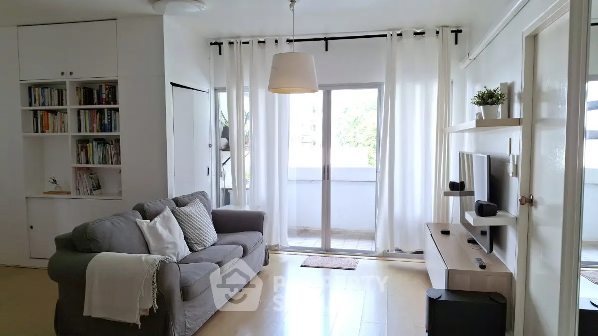 Bright and airy living room with modern decor and balcony access