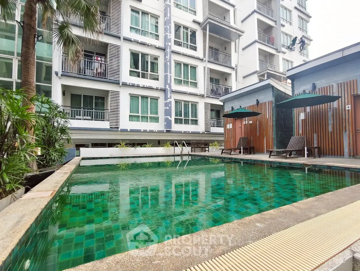 Luxurious condominium with inviting pool and modern amenities