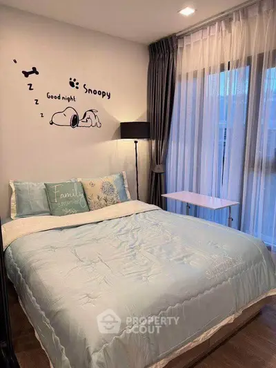 Cozy bedroom with Snoopy wall art and elegant curtains, perfect for restful nights.