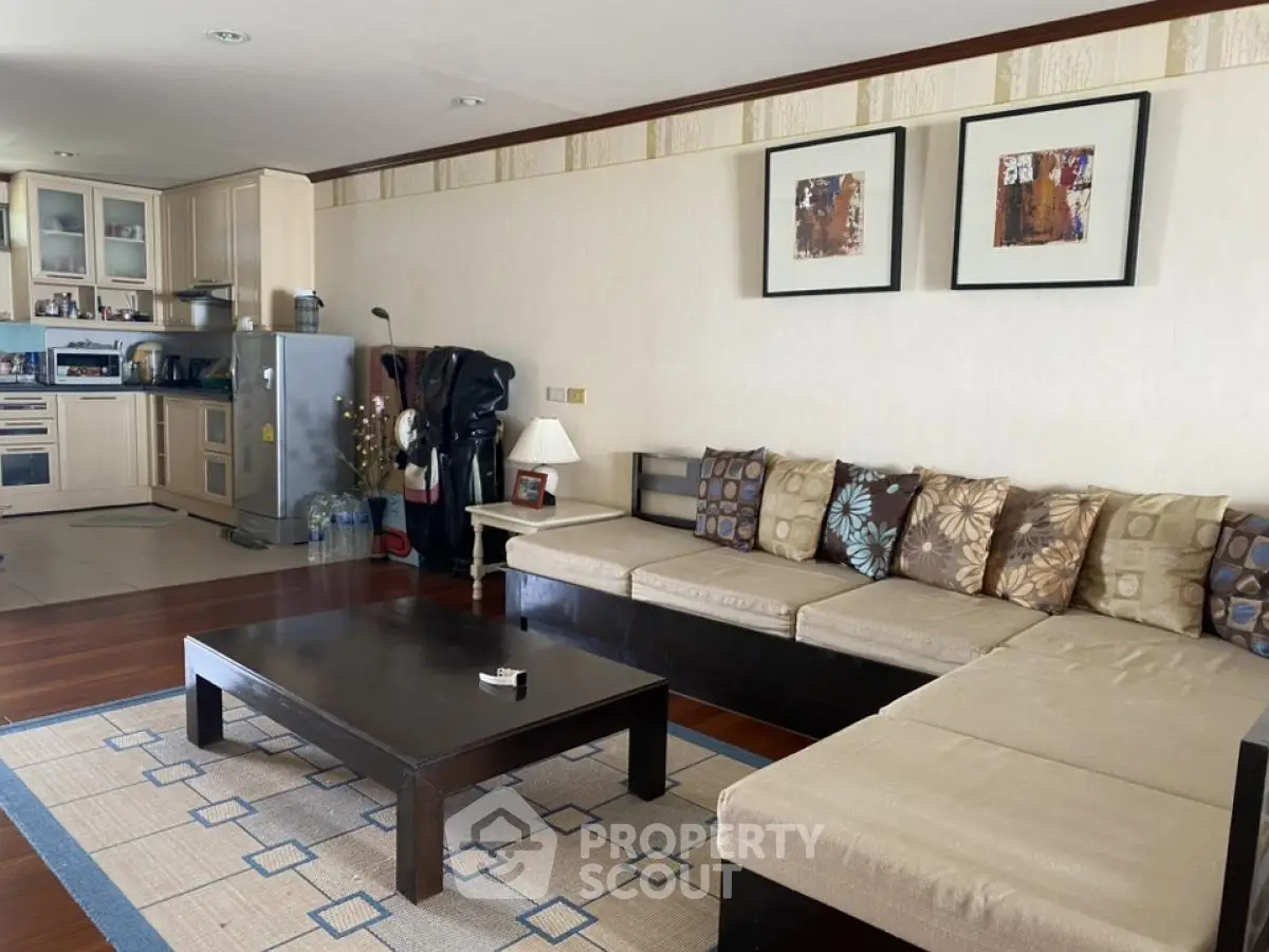 Spacious living room with modern open kitchen and stylish decor