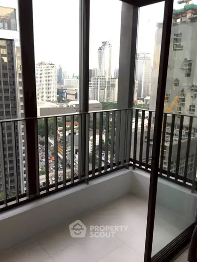 Modern high-rise balcony with stunning cityscape view, perfect for urban living enthusiasts.