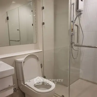 Modern bathroom with glass shower and sleek fixtures
