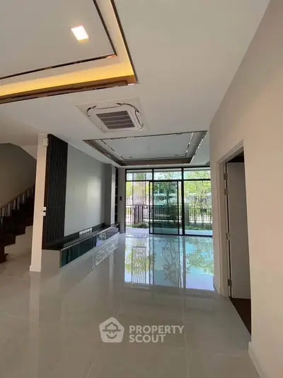 Spacious modern living room with large windows and sleek design