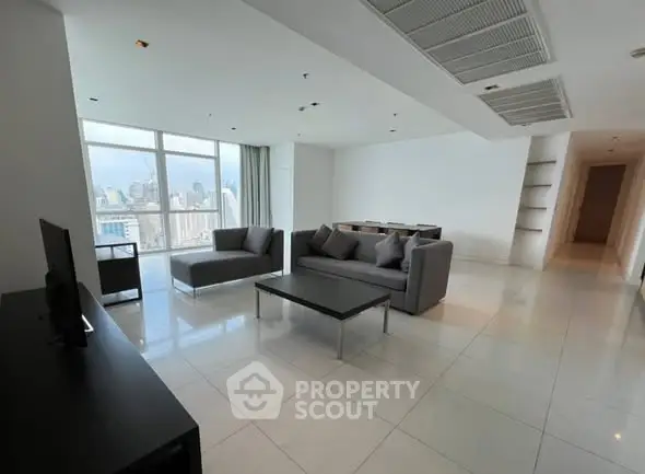 Spacious modern living room with city view and sleek furniture