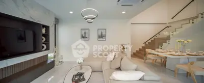 Luxurious modern living room with elegant decor and open dining area, featuring stylish lighting and a cozy ambiance.