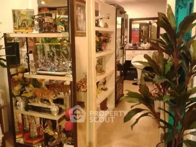 Charming interior with decorative shelves and vibrant plants, perfect for a cozy living space.