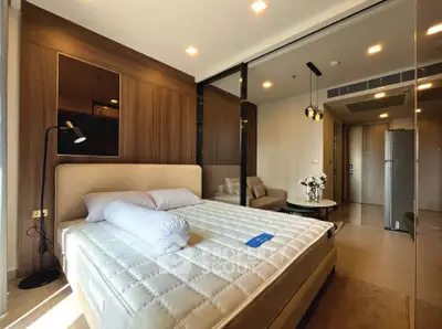 Luxurious modern bedroom with elegant decor and ample natural light