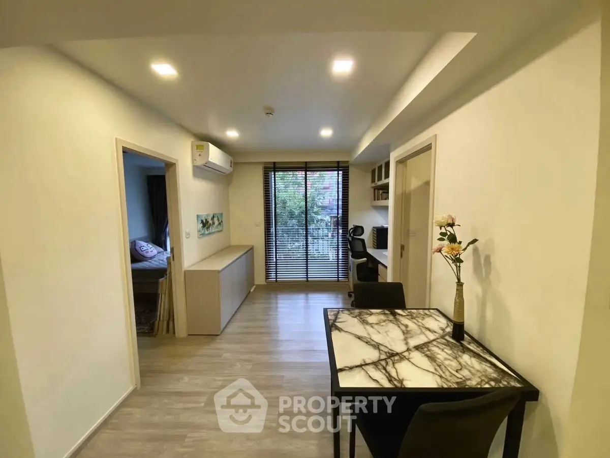 Modern apartment interior with marble dining table and large window view