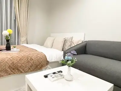 Cozy bedroom with elegant decor and comfortable seating area