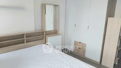 Modern bedroom with sleek wooden furniture and ample storage space