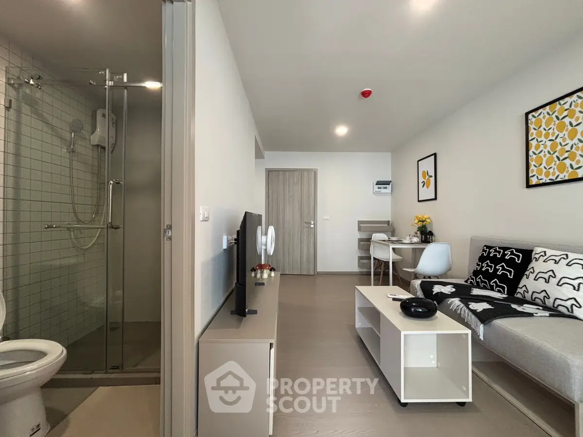 Modern living room with open layout and stylish decor in a contemporary apartment.
