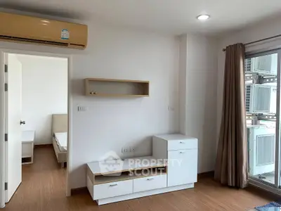 Modern apartment interior with wooden flooring and air conditioning