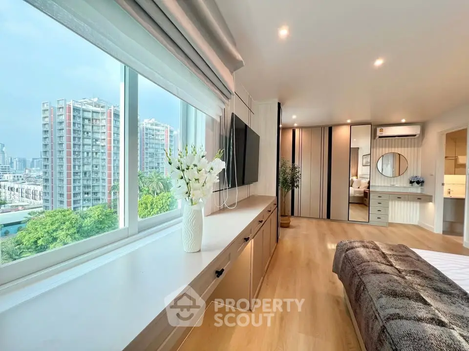Luxurious bedroom with stunning city view and modern decor