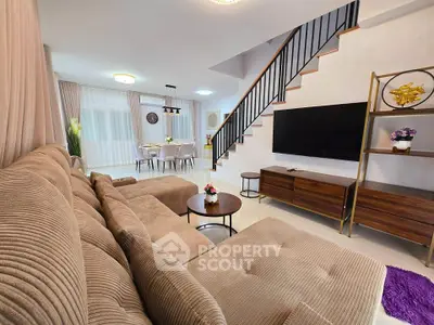 Spacious modern living room with elegant decor and open dining area, featuring a cozy sectional sofa and stylish staircase.