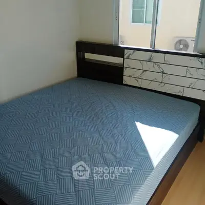 Cozy bedroom with modern bed frame and natural light