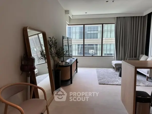 Modern living room with large windows and stylish decor