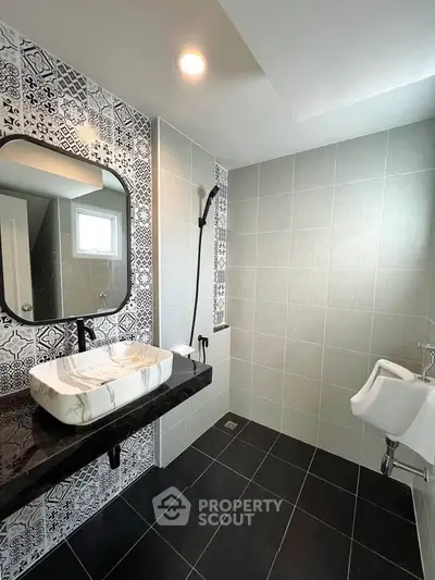 Modern bathroom with stylish tiles and elegant fixtures